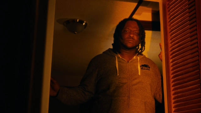 Character looking into glowing clothes drier