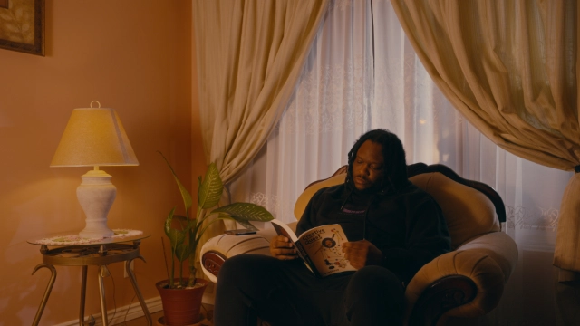 Character looking into glowing clothes drier